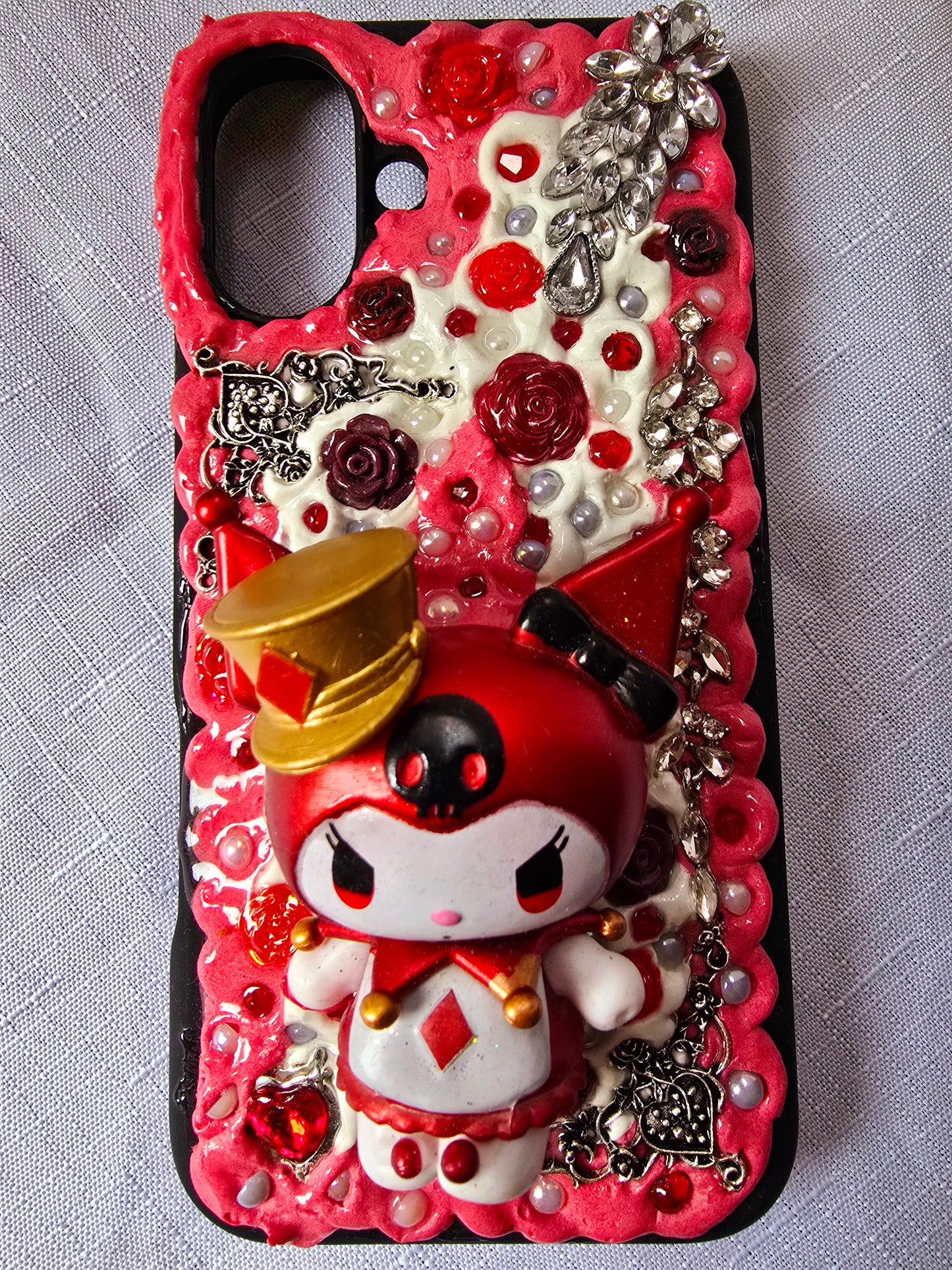 A unique, original handmade red, black, and silver kuromi inspired iPhone 16 plus phone case
