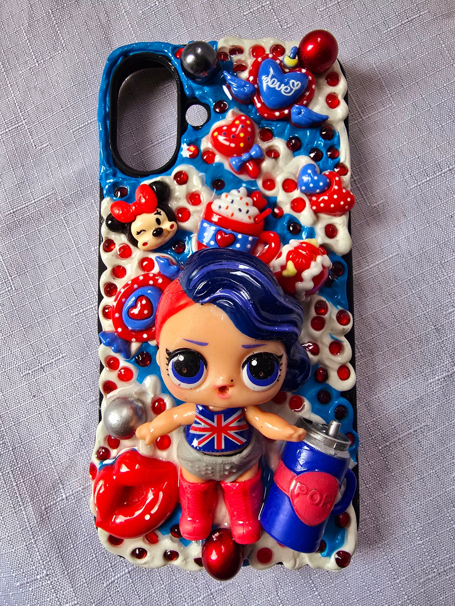 A handmade red and blue iPhone 16 plus phone case