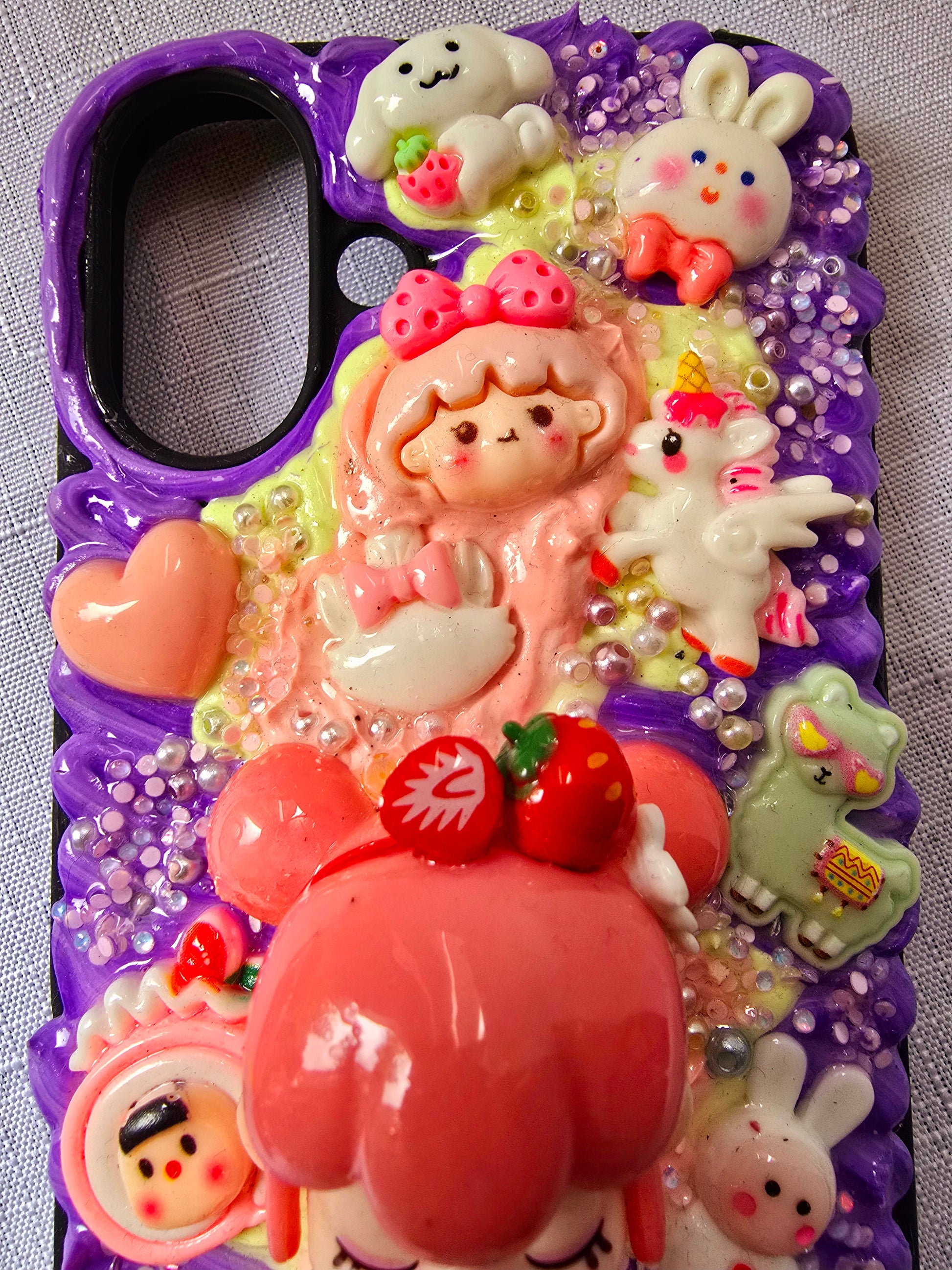 A handmade pink and purple iPhone 16 plus phone case 