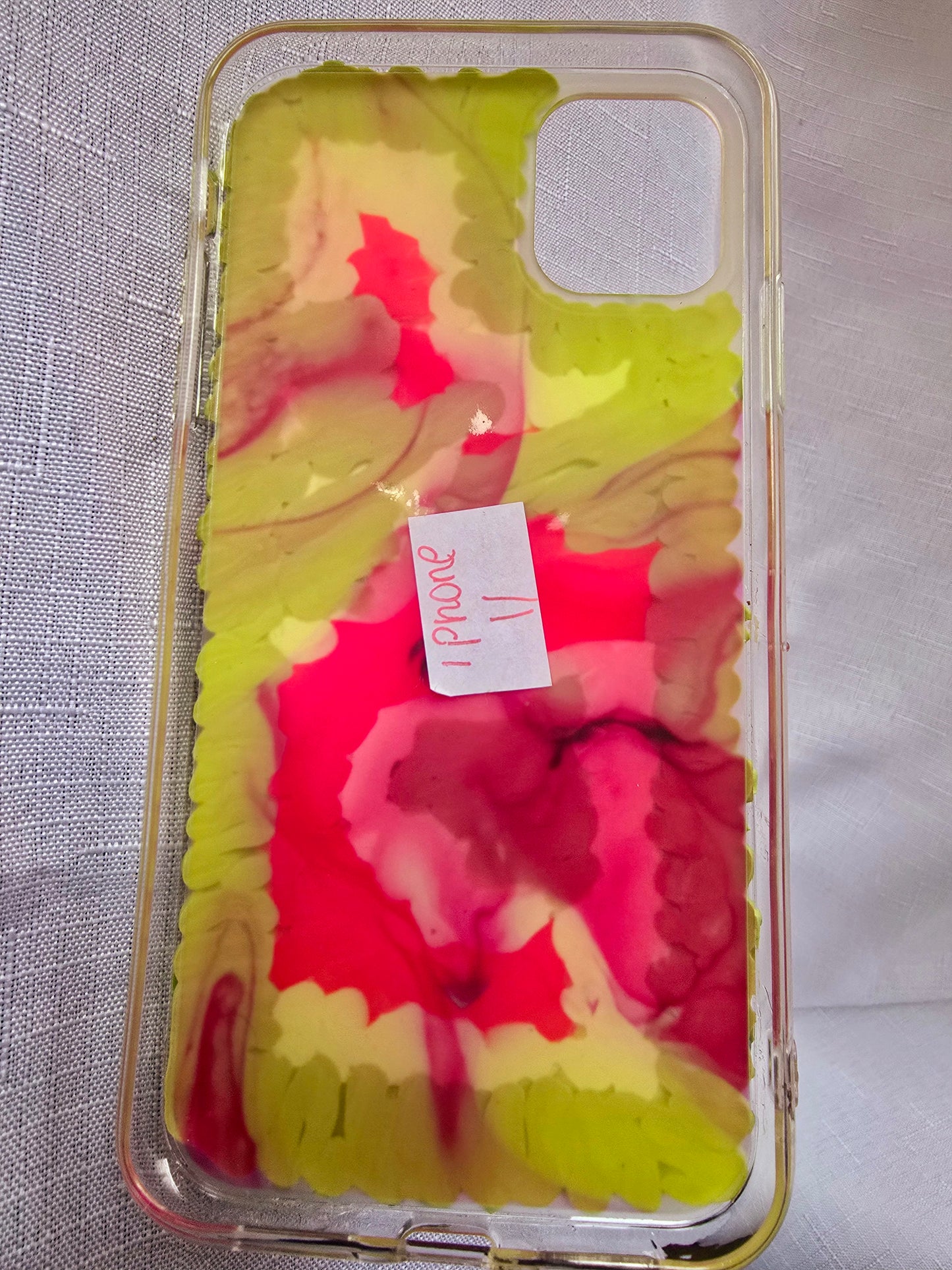 Handmade iPhone 11 phone case in green and pink, featuring a princess theme with floral, animal, and bow accents – cute and whimsical design.