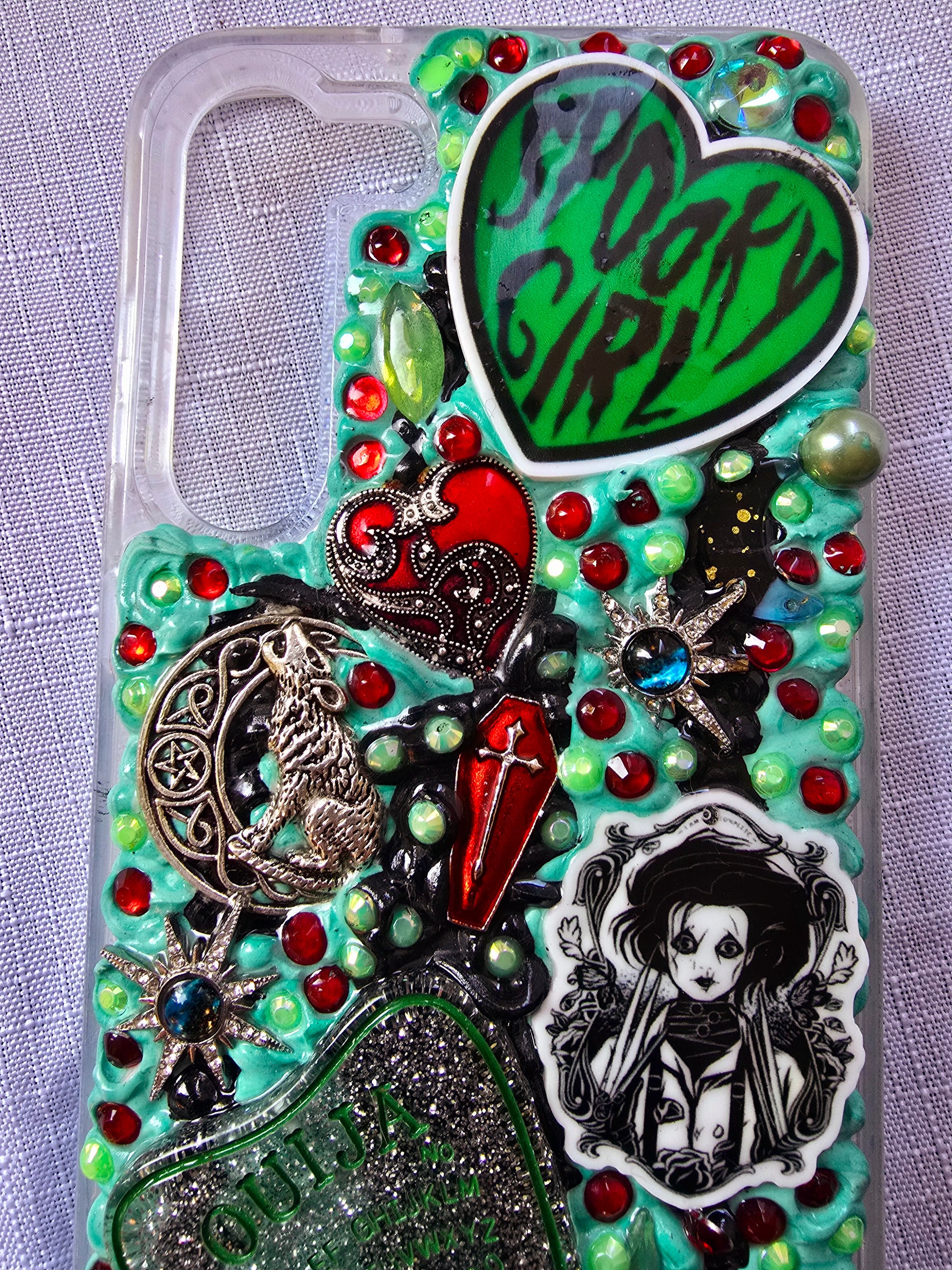 Handmade horror and witchy-themed Samsung S23 Plus phone case in green, red, and black