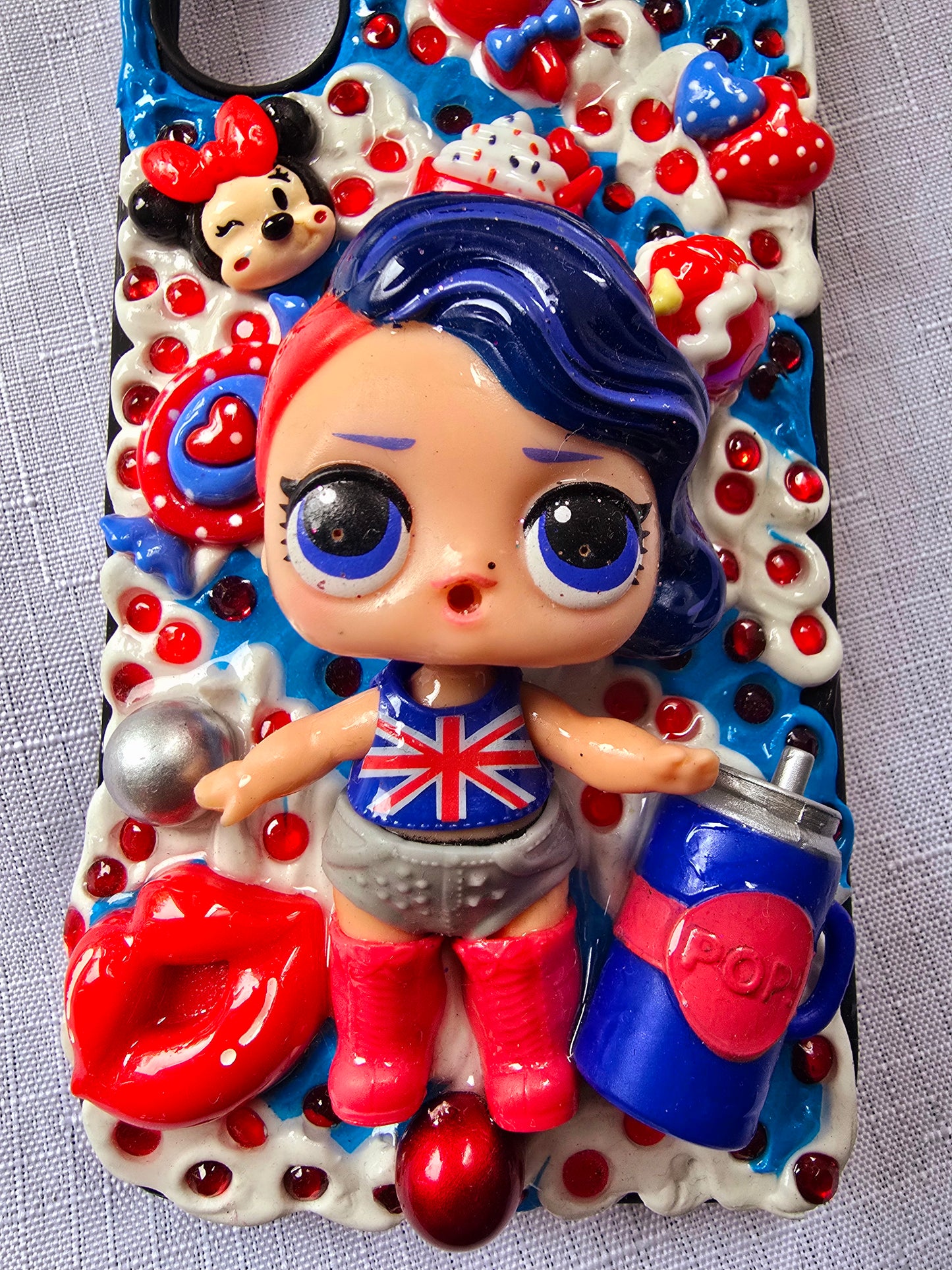 A handmade red and blue iPhone 16 plus phone case