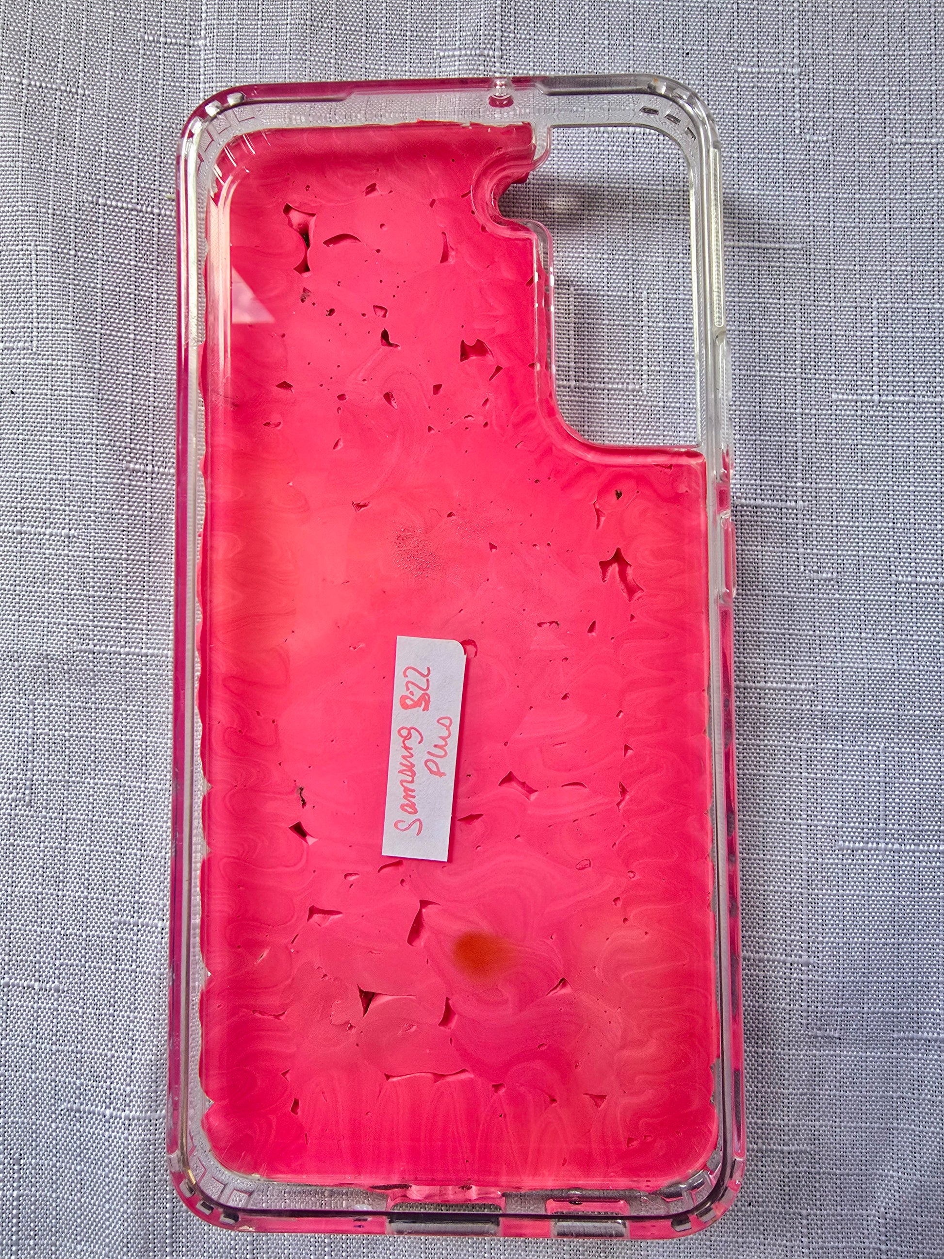 Handmade Samsung S22 Plus phone case with a pink, red, and black witchy kawaii theme, featuring a Ouija planchette, heart charms, My Melody figures, and cute gothic embellishments.