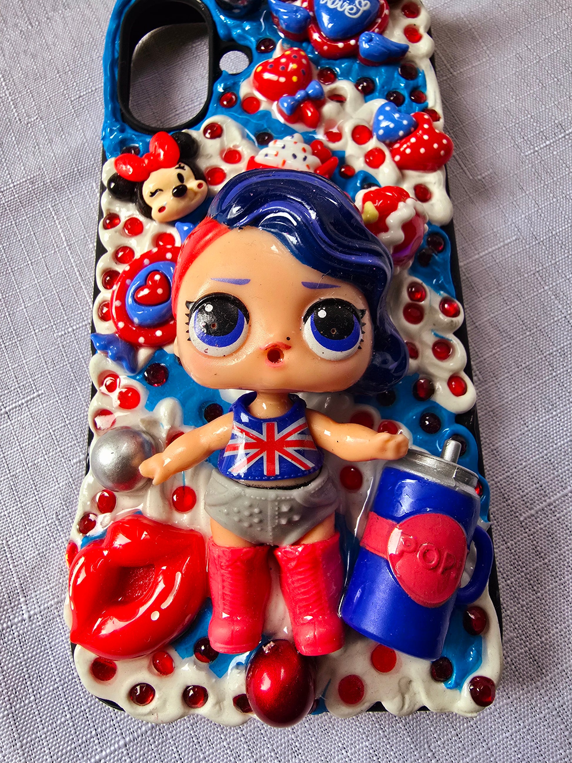 A handmade red and blue iPhone 16 plus phone case