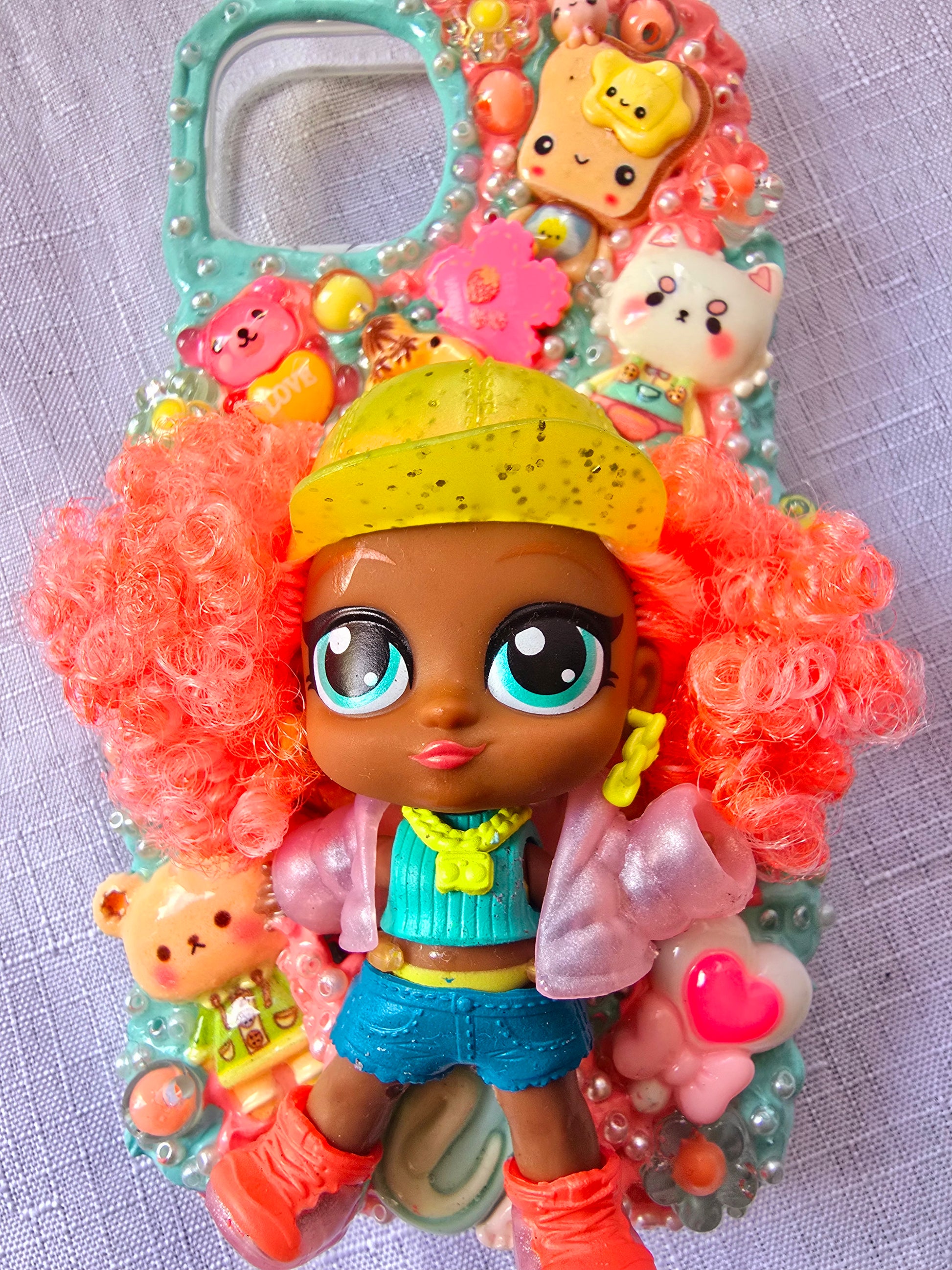 A handmade blue and pink iPhone 13 phone case