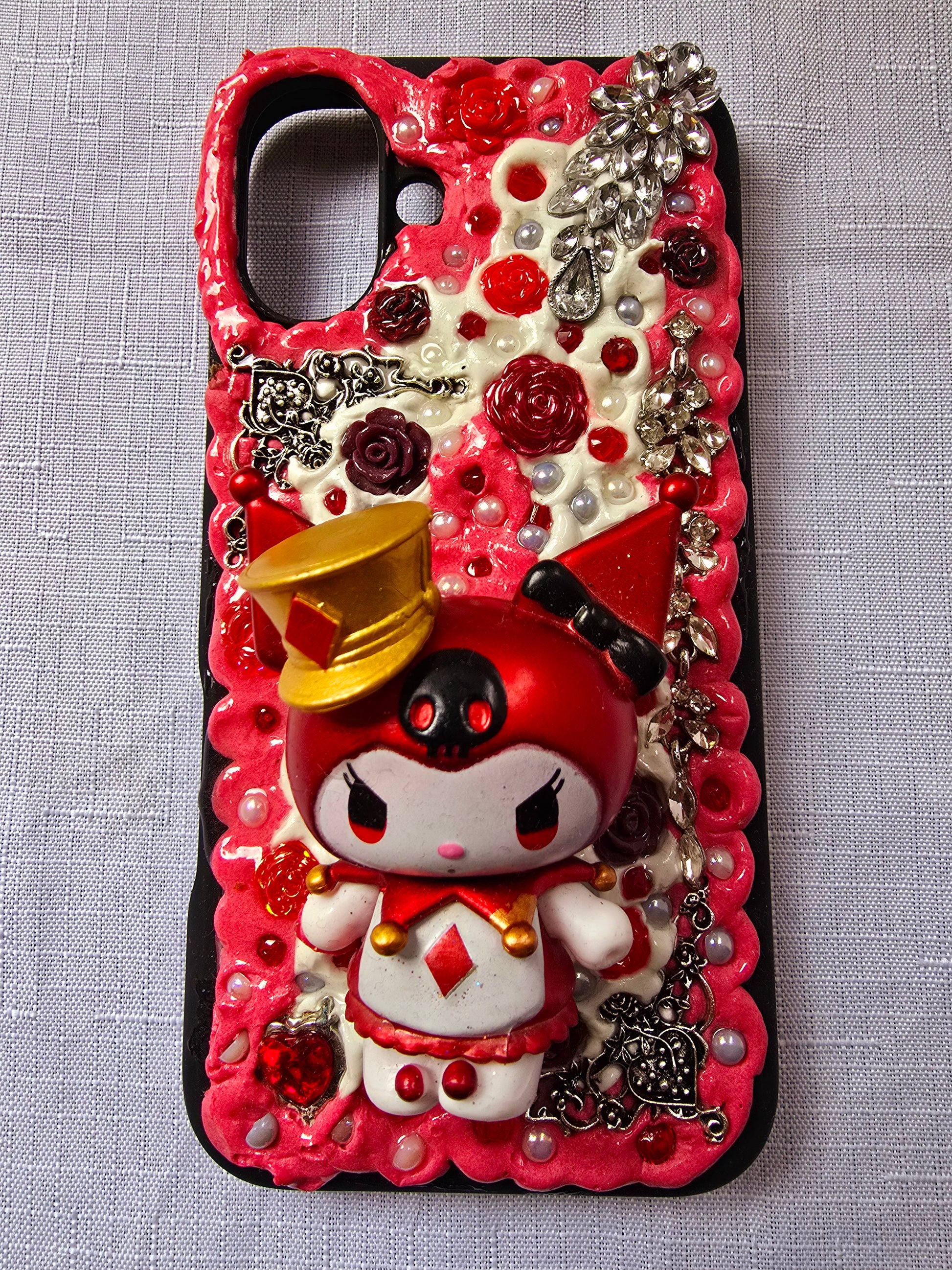 A unique, original handmade red, black, and silver kuromi inspired iPhone 16 plus phone case