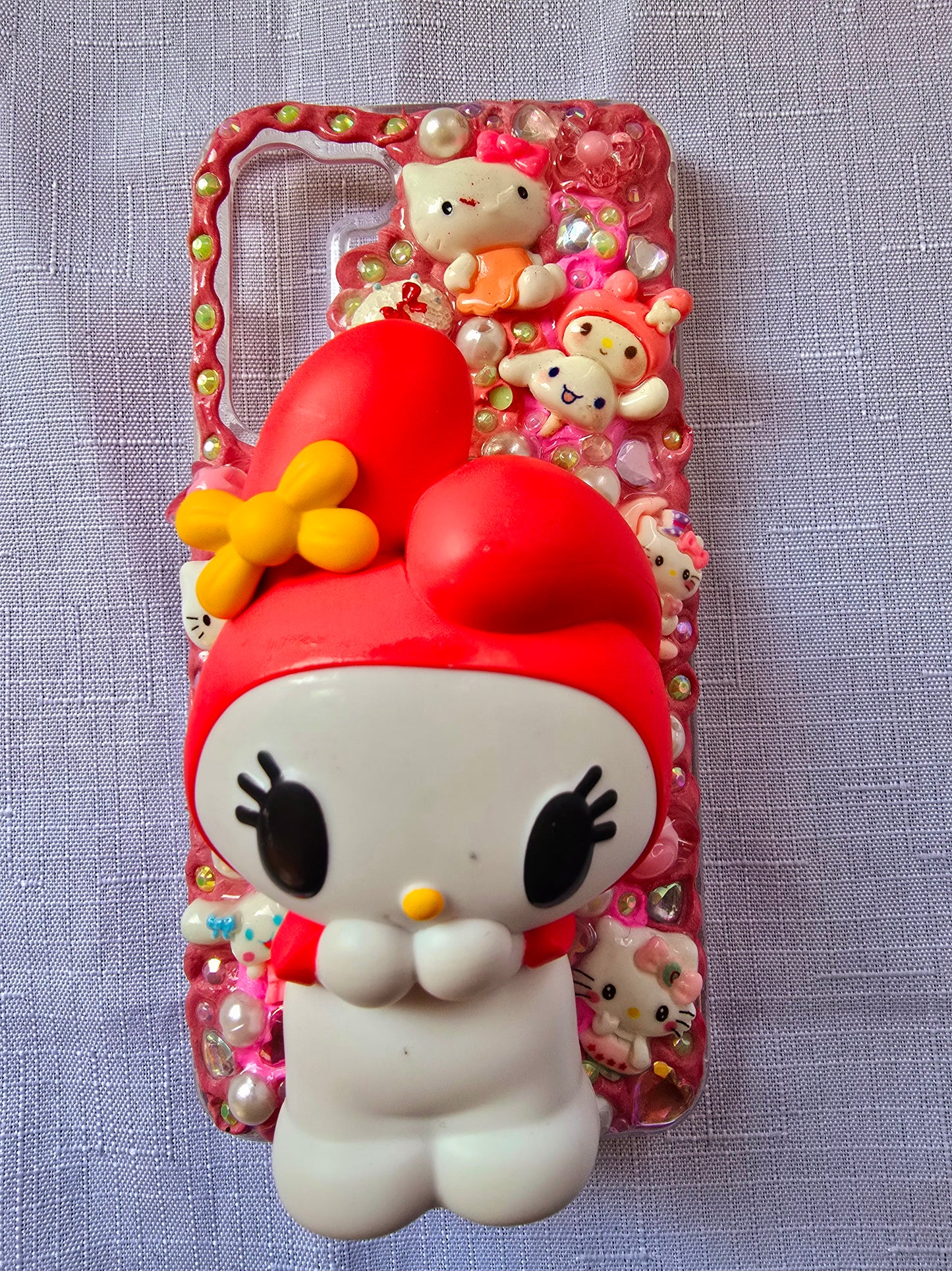Handmade Samsung S23 Plus phone case featuring a My Melody theme in pink, white, and yellow with cute 3D decorations and kawaii charm accents.