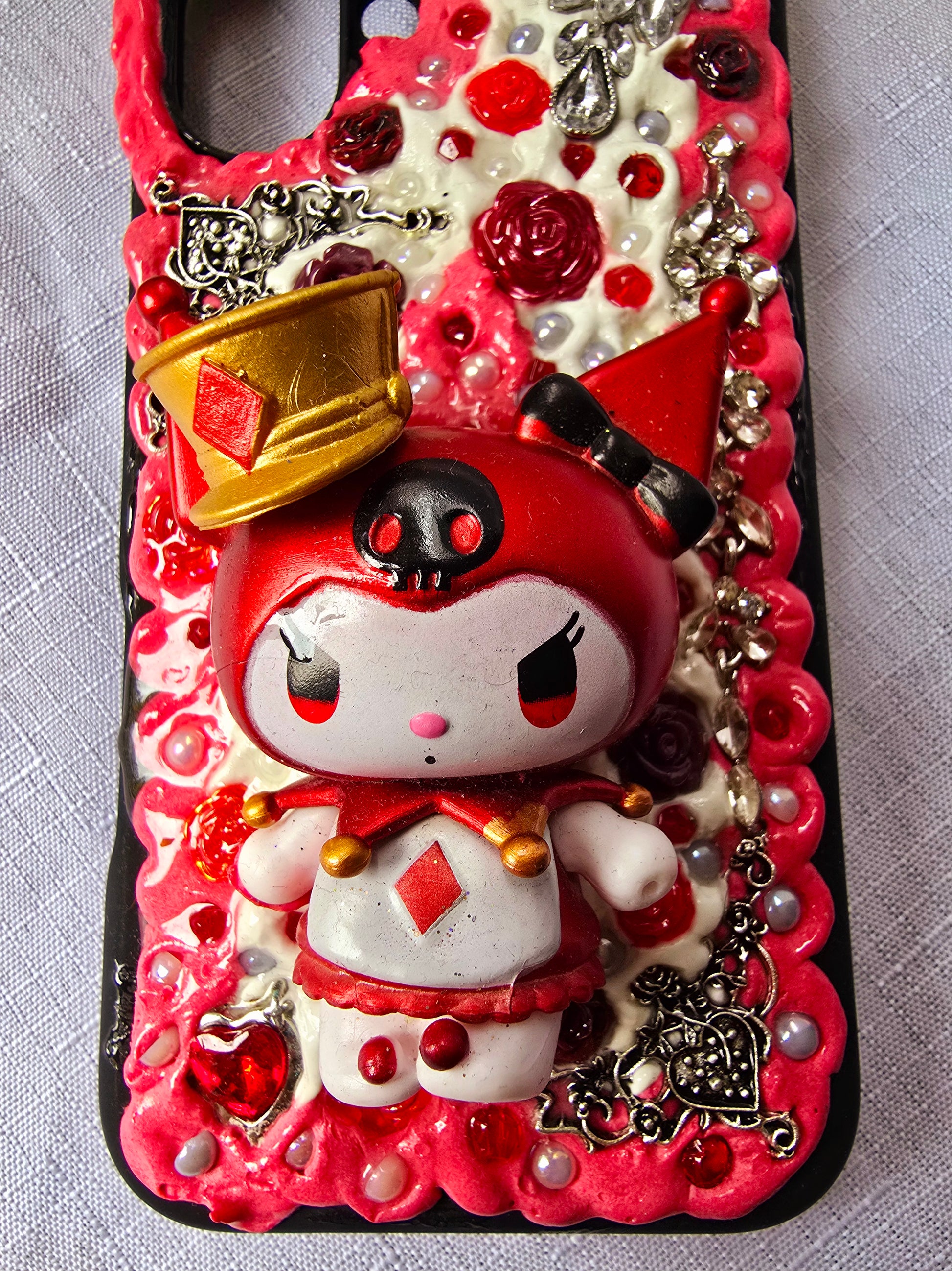 A unique, original handmade red, black, and silver kuromi inspired iPhone 16 plus phone case