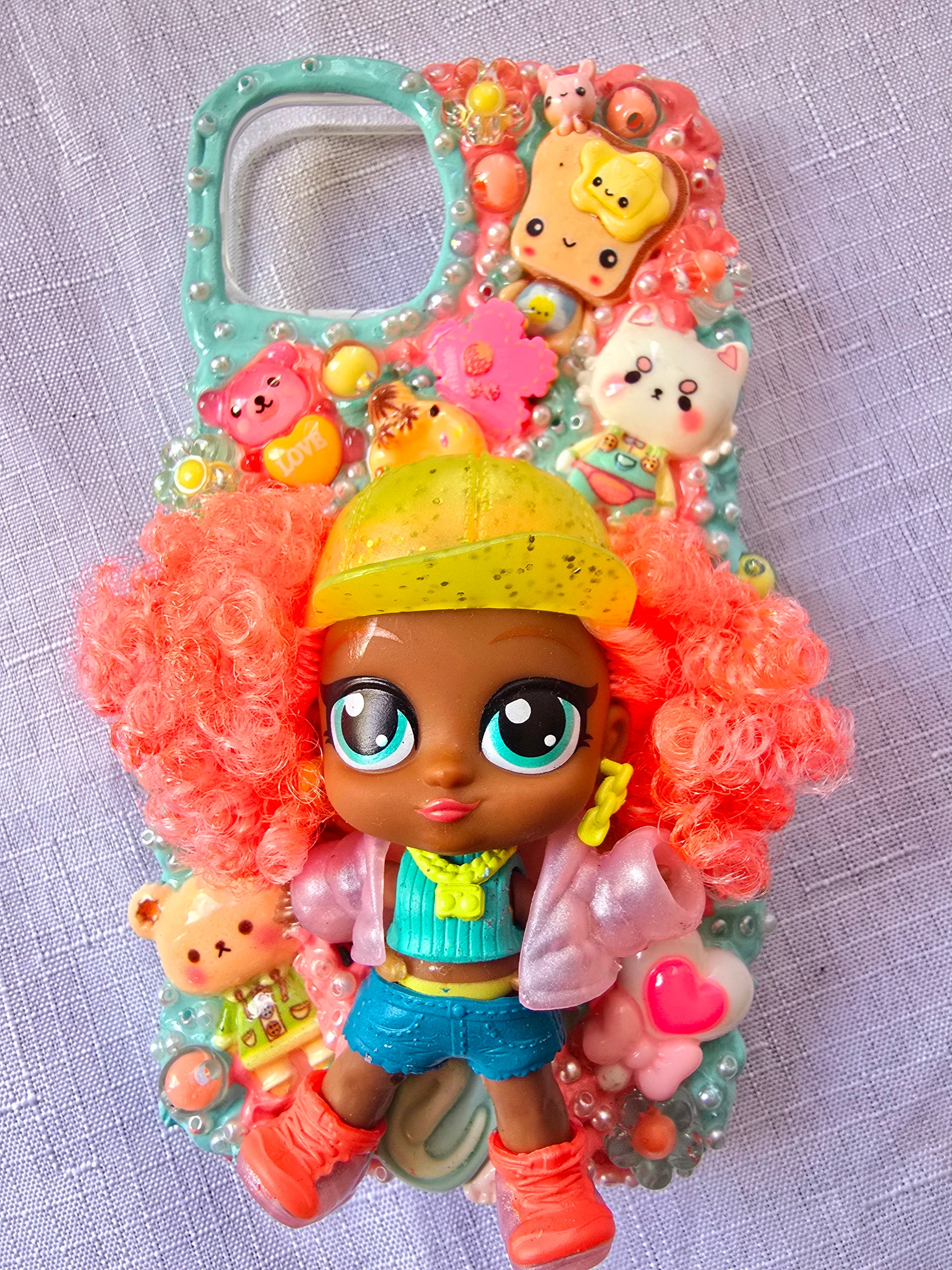 A handmade blue and pink iPhone 13 phone case